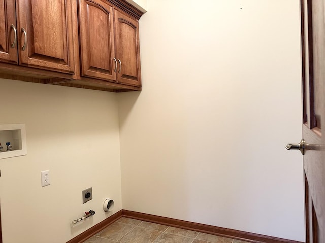 clothes washing area with cabinets, hookup for a washing machine, electric dryer hookup, light tile patterned floors, and hookup for a gas dryer