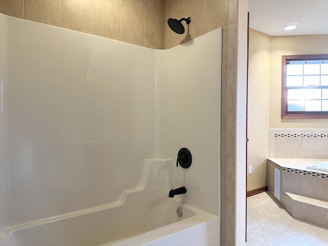 bathroom with tile patterned flooring and tiled shower / bath combo