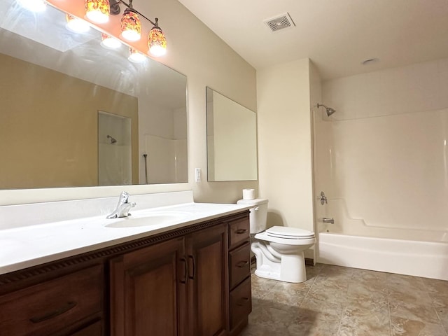 full bathroom with vanity, toilet, and shower / washtub combination