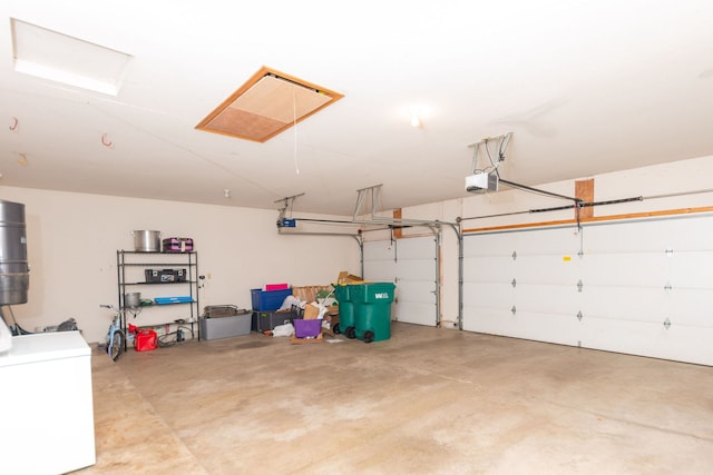 garage featuring a garage door opener and fridge