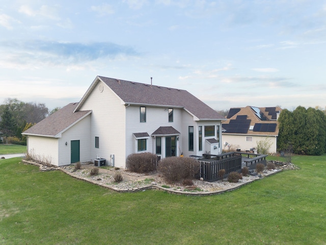 back of property with a yard and cooling unit