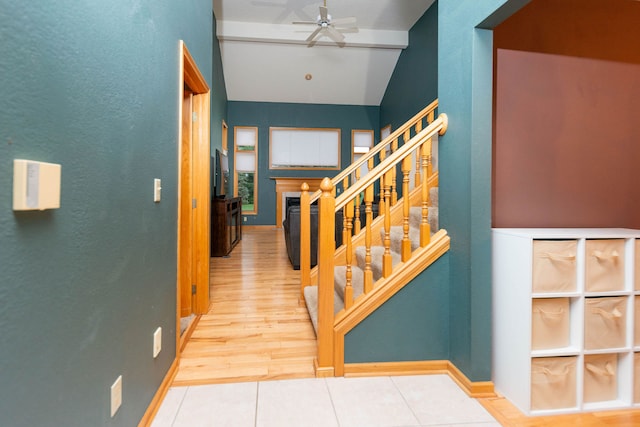 interior space featuring hardwood / wood-style flooring, ceiling fan, and lofted ceiling