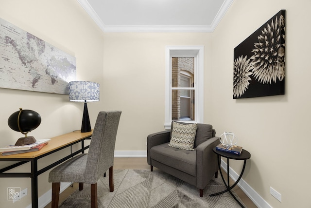 office area featuring baseboards, crown molding, and wood finished floors