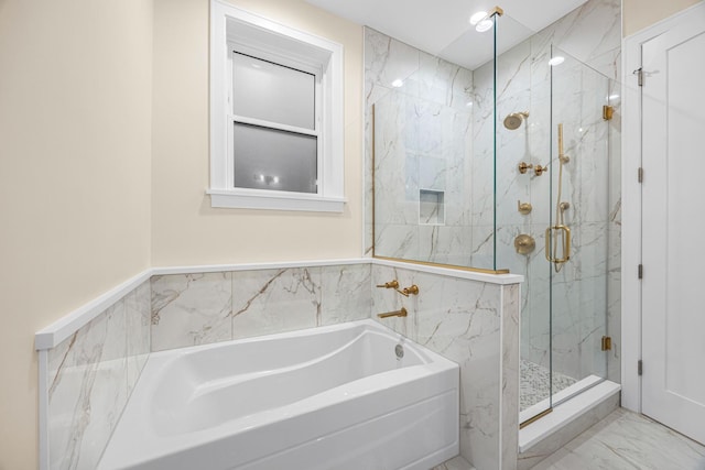 full bath with marble finish floor, a marble finish shower, and a bath