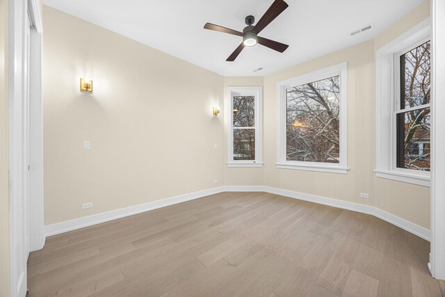 empty room featuring light hardwood / wood-style floors and ceiling fan