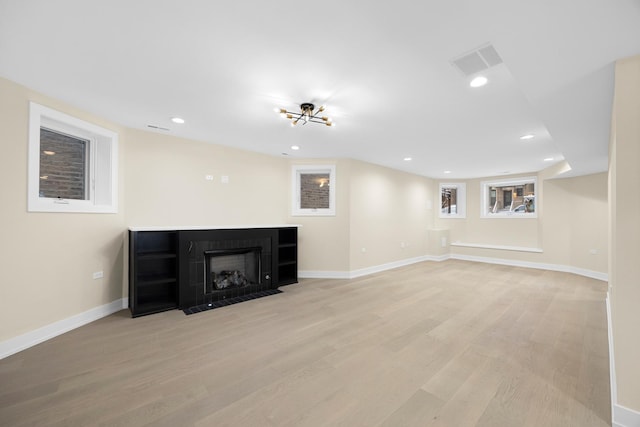 unfurnished living room with light hardwood / wood-style floors