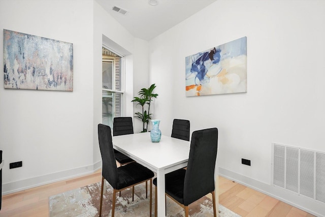 dining room with hardwood / wood-style floors