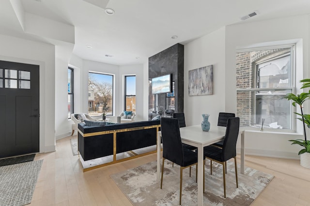 dining room featuring light hardwood / wood-style flooring