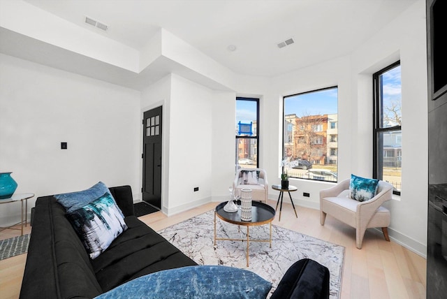 living room with light hardwood / wood-style floors