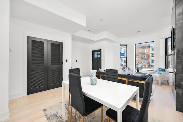 dining space with light wood-type flooring