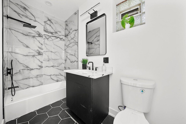 full bathroom featuring vanity, toilet, and tiled shower / bath combo