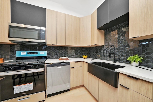 kitchen with backsplash, light brown cabinets, sink, and stainless steel appliances