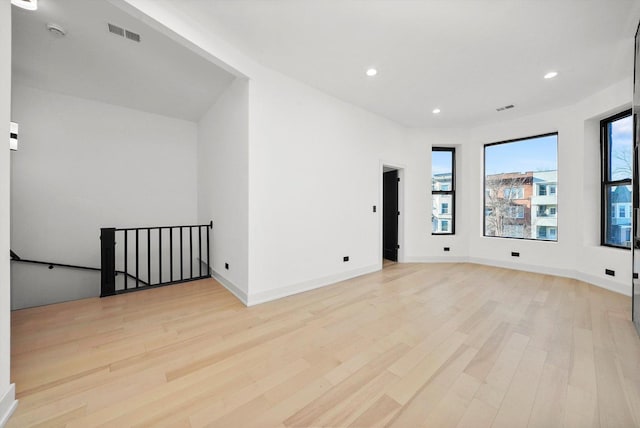 spare room with light wood-type flooring