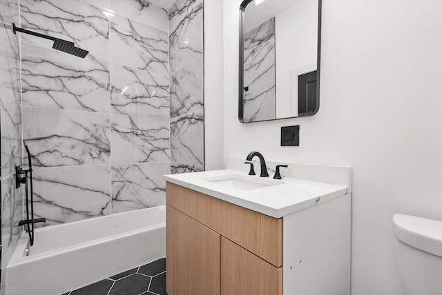 full bathroom with tile patterned flooring, vanity, toilet, and  shower combination