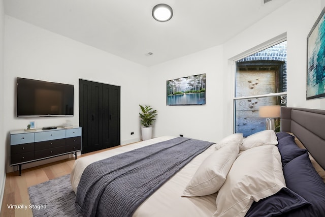 bedroom with light hardwood / wood-style floors