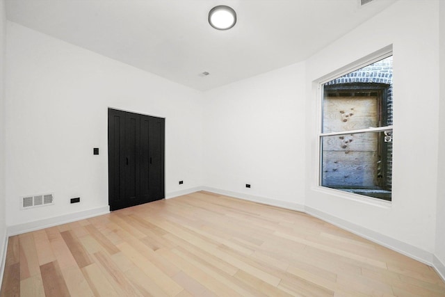 empty room featuring light hardwood / wood-style floors