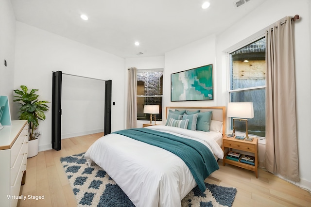 bedroom with light wood-type flooring