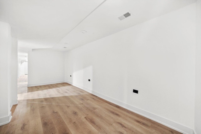 empty room with light hardwood / wood-style floors