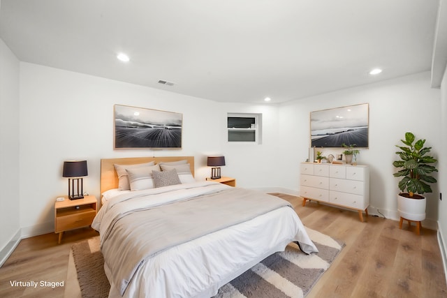 bedroom with light hardwood / wood-style floors