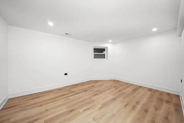 spare room with light wood-type flooring