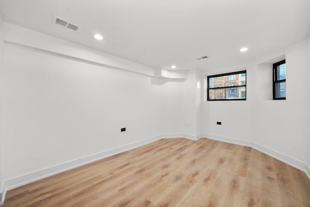 basement featuring light hardwood / wood-style floors