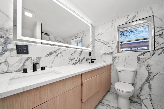 bathroom with vanity, toilet, and walk in shower