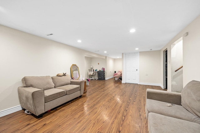 456 E 170th St, South Holland, IL 60473 - living area with wood finished floors, recessed lighting, baseboards, baseboard heating, and stairs