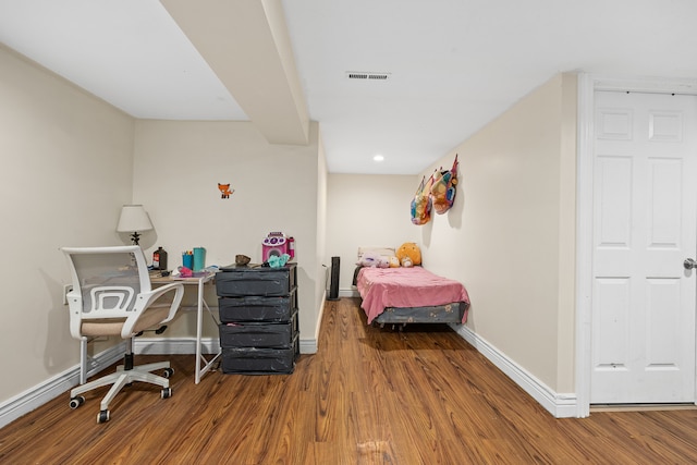 bedroom featuring wood-type flooring