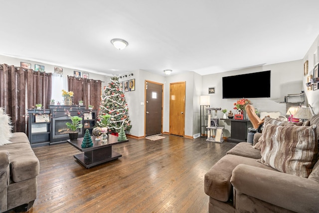 456 E 170th St, South Holland, IL 60473 - living area with dark wood-style flooring, a fireplace, and baseboards