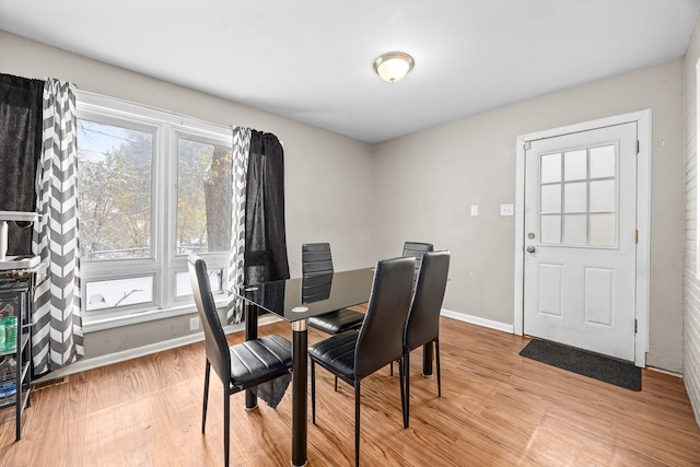 dining area with light hardwood / wood-style floors