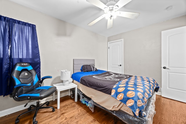 bedroom featuring ceiling fan and wood-type flooring