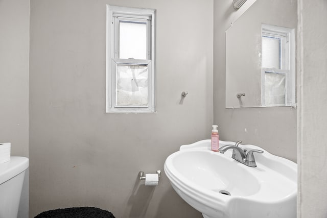 bathroom with toilet and sink