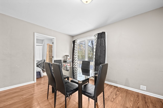 dining area featuring wood-type flooring