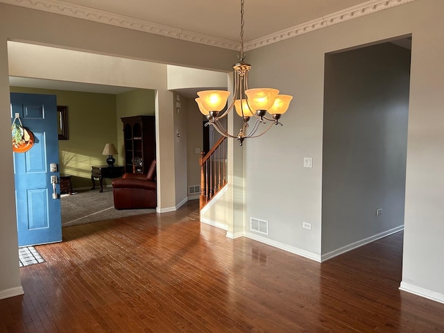 interior space with dark hardwood / wood-style floors and a chandelier