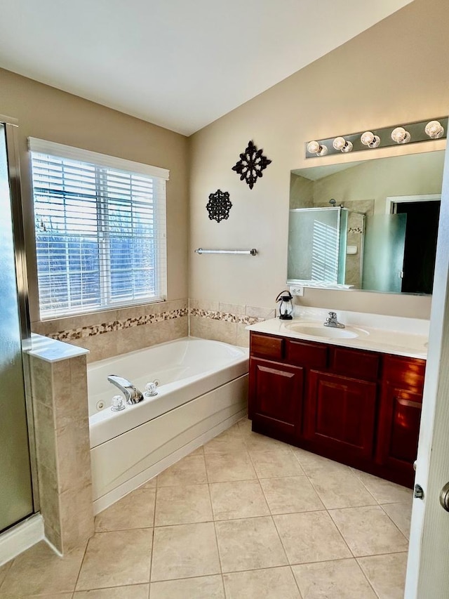 bathroom featuring tile patterned floors, plus walk in shower, vaulted ceiling, and vanity