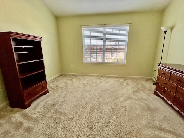 bedroom with light colored carpet