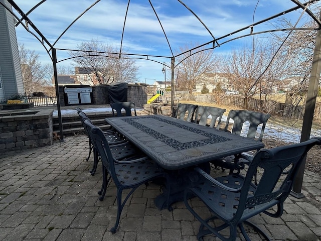 view of patio featuring exterior kitchen