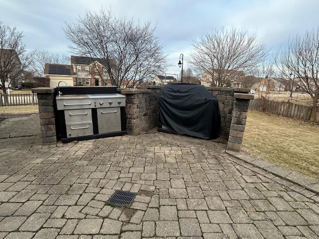 view of patio with a grill and an outdoor kitchen