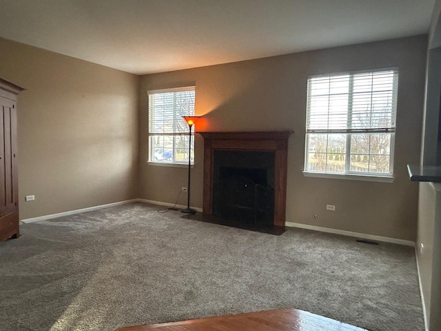 unfurnished living room with carpet flooring