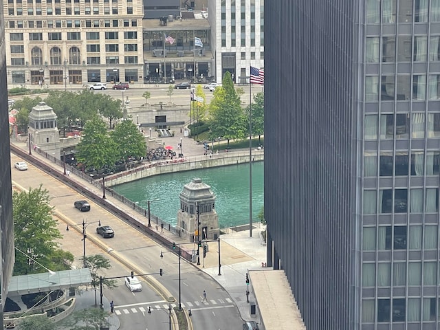 view of swimming pool with a water view