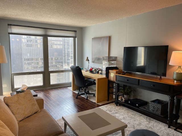 office area featuring hardwood / wood-style floors and a textured ceiling