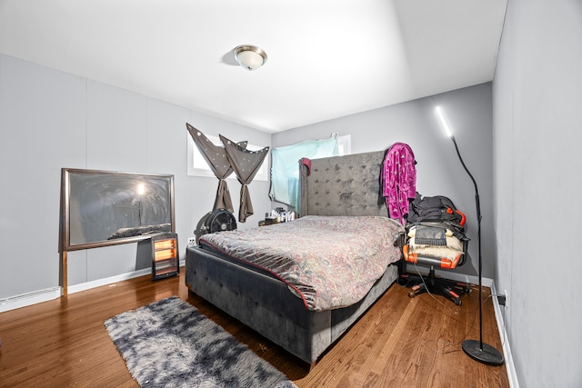 bedroom with hardwood / wood-style flooring