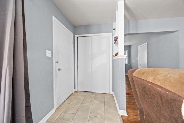 hallway featuring light tile patterned flooring