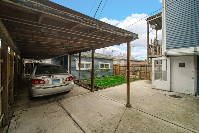 view of vehicle parking featuring a carport