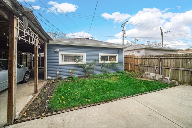 view of side of property with a yard