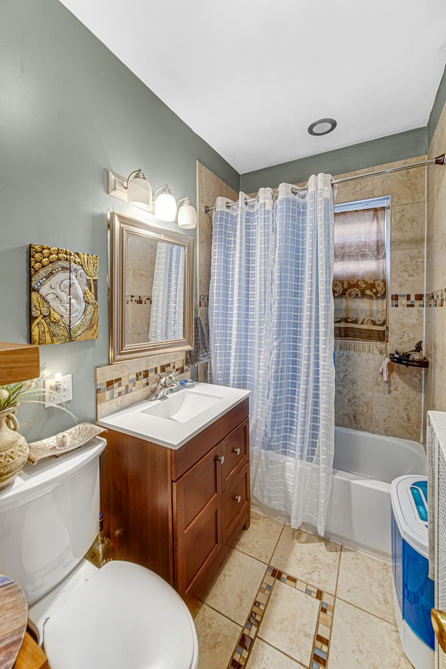 full bathroom with vanity, tile patterned flooring, shower / bathtub combination with curtain, and toilet