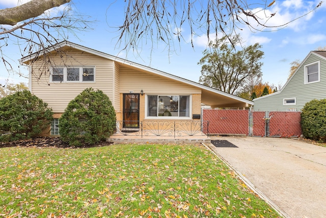 view of front of property with a carport and a front lawn