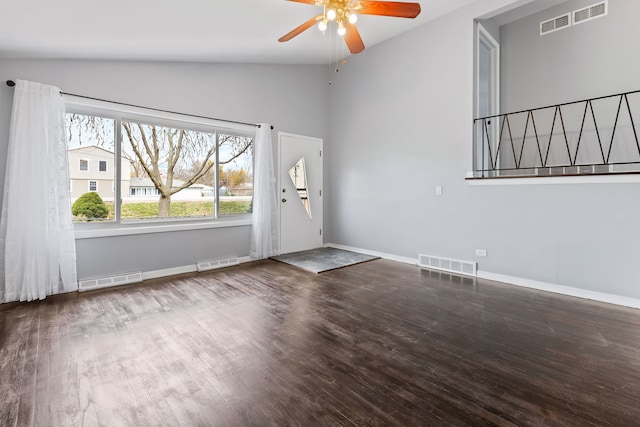 interior space featuring ceiling fan, wood-type flooring, and vaulted ceiling