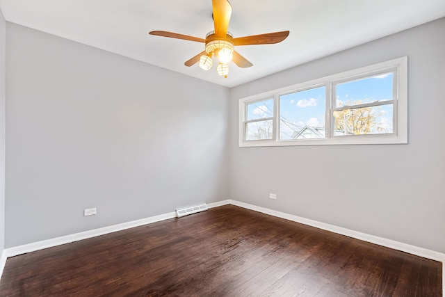 spare room featuring wood-type flooring and ceiling fan