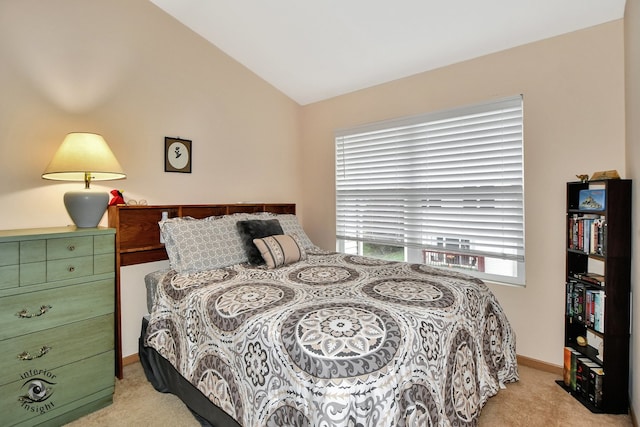 carpeted bedroom with vaulted ceiling